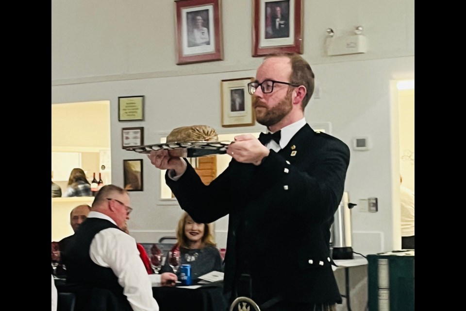 As for the much-revered haggis, it was borne before those gathered by Jordan Craib-Petkau.