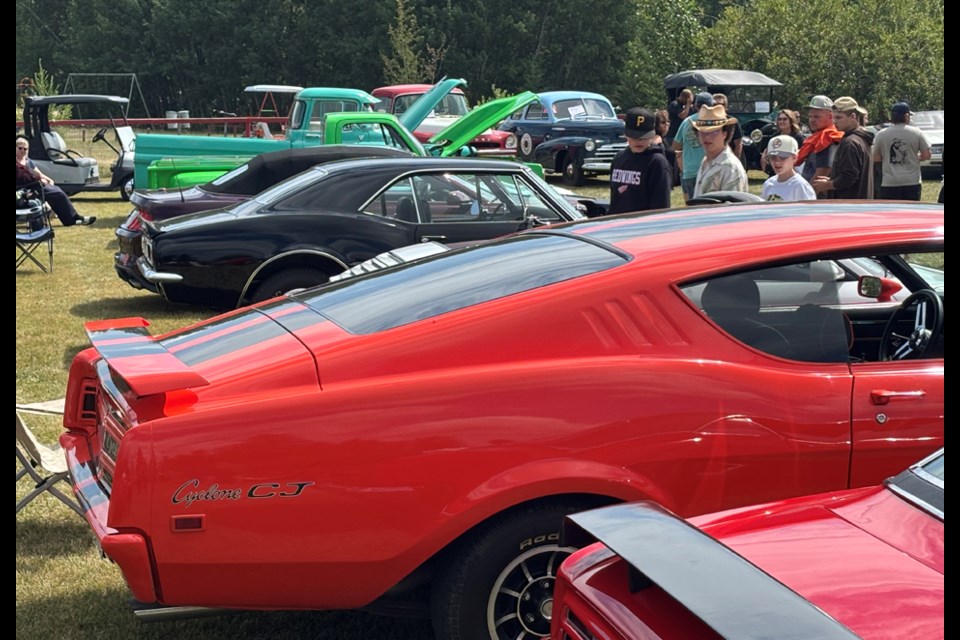 Crowds and cars mingle on a beautiful summer day in Meota. 