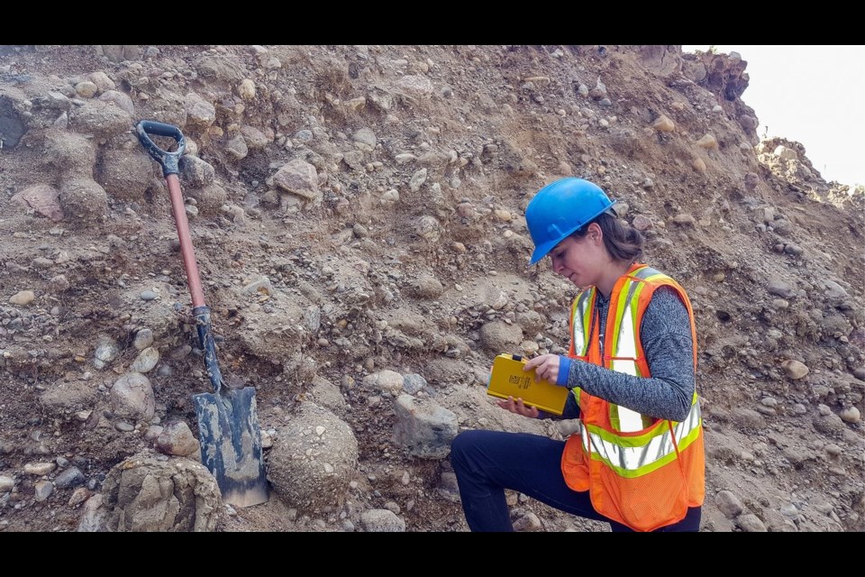 Sophie Norris, who led a team of researchers as a University of Alberta Faculty of Science PhD student, takes samples in Fort McMurray Wood Buffalo's rural areas. Norris was studying an ancient flood that covered much of the prairies 12,000 years ago.