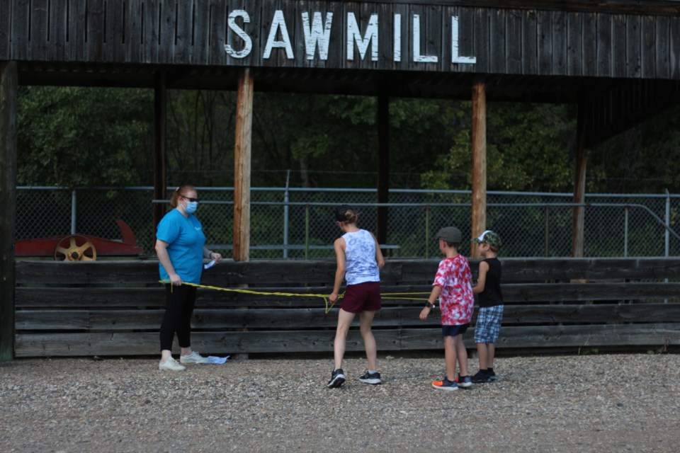 Solange Massicotte, Education and Public Programs Coordinator with the Western Development Museum, practices her rope-making with youths of the 'Blast from the Past' summer camp.