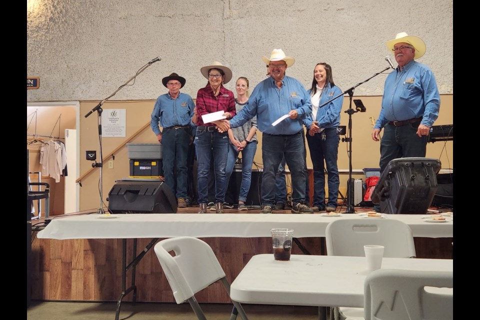 Unity Western Days committee co-chair, Brian Woytiuk, presents Mayor Sharon Del Frari, one of eight $5,000 donations given out June 2 as part of the UWD 40th anniversary celebrations.