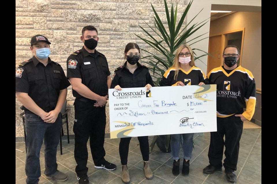 As part of its efforts to support non-profit groups that support community development, the Crossroads Credit Union Community Investment Fund awarded $15,000 to the Canora Fire Brigade on October 21. From left, were: Mathew Dmitruik, Michael Doogan and Carrie Schaeffer (Canora Fire Brigade), and Michelle Goetzinger and Jeff Bisschop (Crossroads staff). / Crossroads Credit Union

