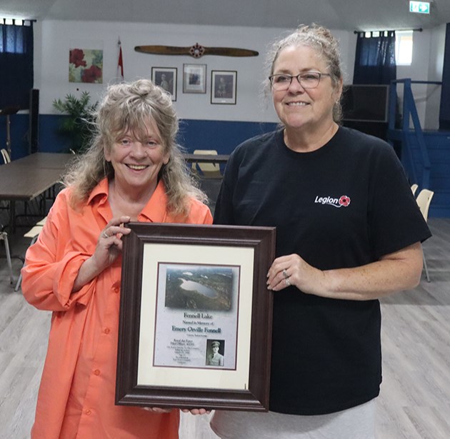 On June 1, Shelley Price-Jones, left, presented President Cathy Trach, representing the Canora branch of the Royal Canadian Legion, with a framed photo of her uncle, Pilot Officer Emery Orville “Flash” Fennell of Canora, who was killed in action while flying a mission during the Second World War in 1940. 