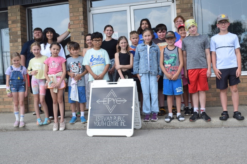 Young people and EPYC staff gather for a group photo with representatives of the Saskatchewan Science Centre. 