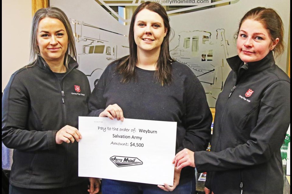 Rosalynn Meyer, centre, safety and HR supervisor for Jerry Mainil Ltd., presented a donation of $4,500 from staff and management to Shannon Fodchuk, left, and Cassy Baumgartner of the Salvation Army on Friday morning.