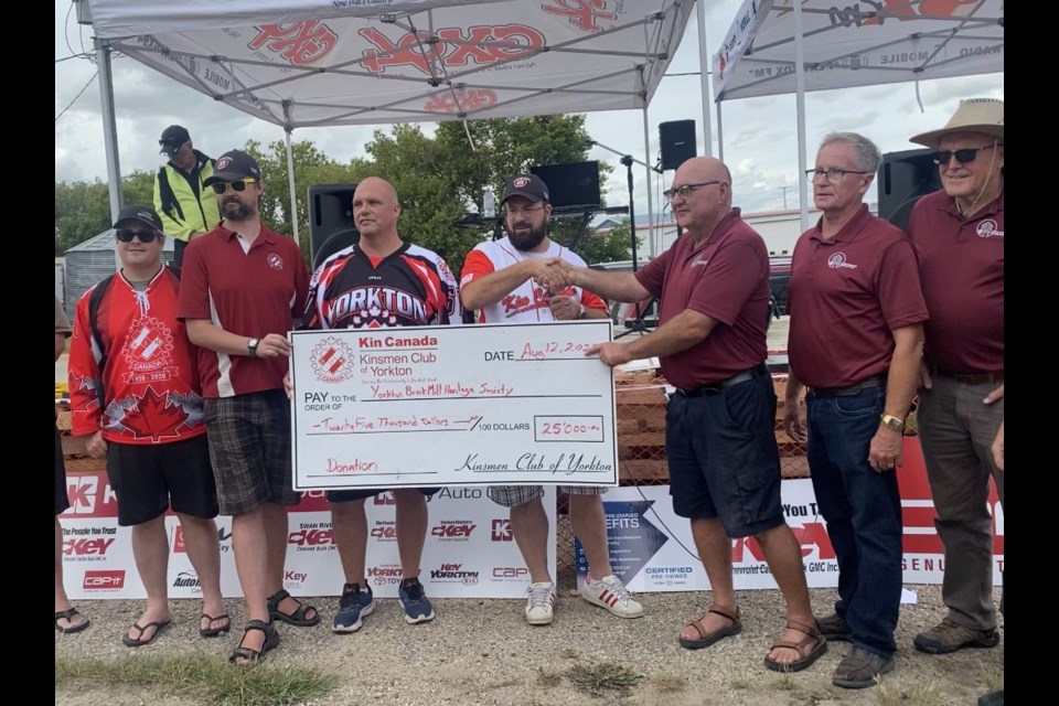 Members of the Yorkton Kinsmen Club presented a cheque to Thom Weir, Larry Pearen and Clark Anderson of the Yorkton Brick Mill Heritage Society at Saturday's Rally Round the Mill event.