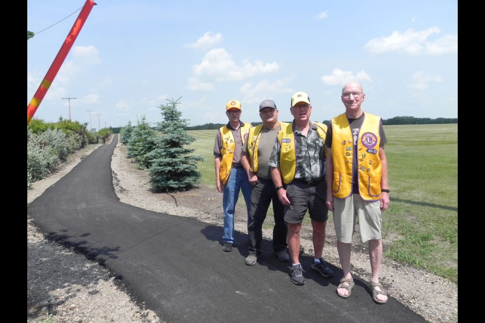 The pride of these Lions was evident as they stood before the newest paved section of the ongoing pathway project in Unity.