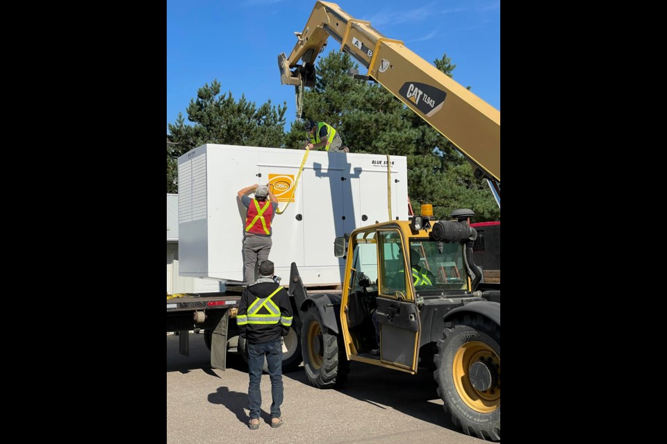 It took a team to help unload the new standby generator that arrived at Luther Place Sept. 6, ready for installation.