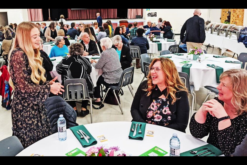 Guest speaker Lauren Kohl joked with her mom, Kathy, and Kathy Coroluick, prior to the Mayor's Luncheon event for the CMHA on Tuesday at McKenna Hall