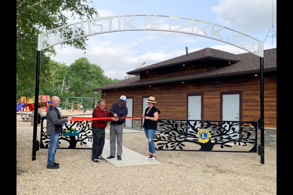 The official cutting of the ribbon was performed by, from left, Moose Mountain Lions Club member Brent Ruthven, Resort Village of Kenosee Lake Mayor Ed Plumb, Kenosee recreation director and Lions member Kent Sauter and Lions president Jillian Armstrong. 