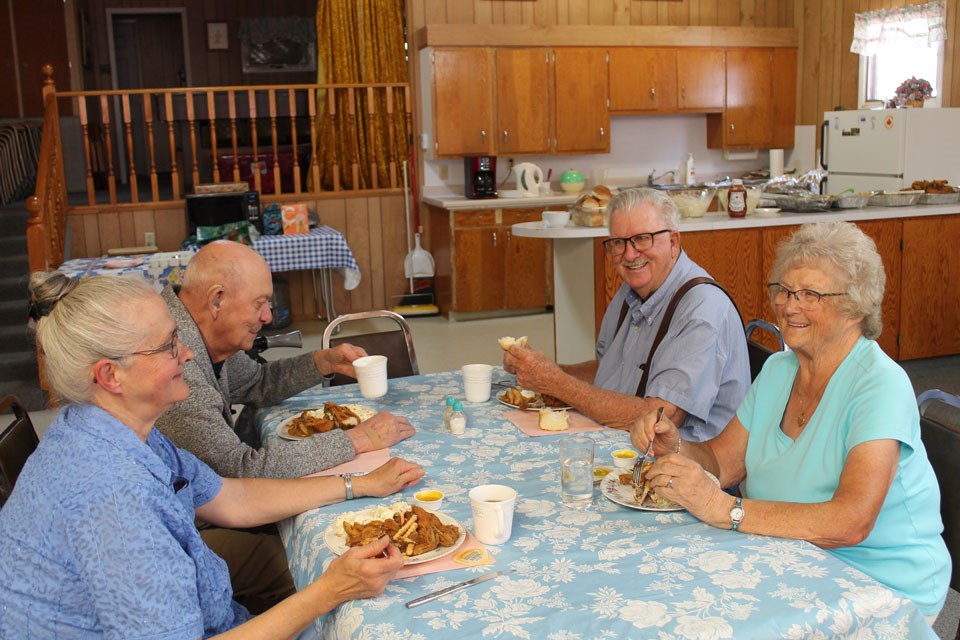 From left, Debbie and Harvey Stevenson, sitting across the table from Jim and Joan Carnduff. 