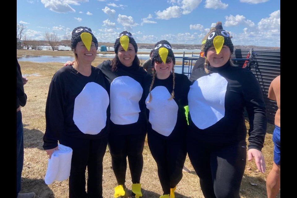 Penguins are two members of the Lloydminster Kinette Club and two members of the Maidstone Kin Club, who took part in the Polar Dip challenge to raise funds for Cystic Fibrosis.