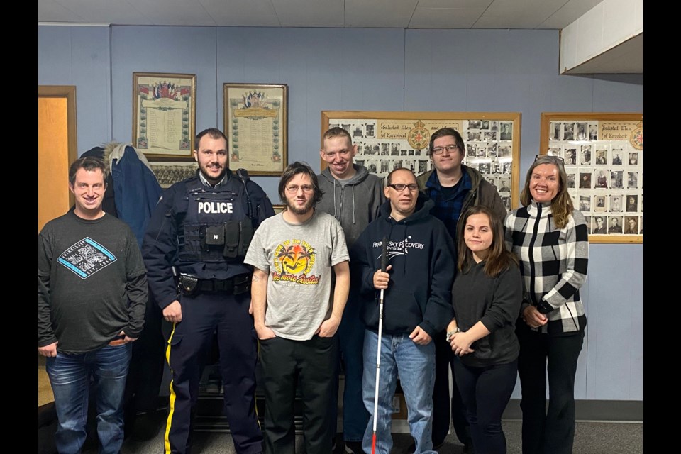 RCMP Cst. Michael Wedel  stands amongst participants in recent community education session held at Prairie Branches.  Staff, Stacey Tischler, Marleah Whyte, Johathan Turner-Nitscher, and participants, Chad Riendeau, Darren Hood, Daniel Germann and Joe Phillips.