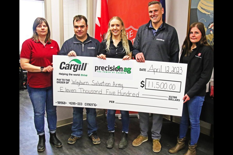 The Salvation Army in Weyburn received a donation of $11,500 from Precision Ag and Cargill on Wednesday. From left are Nicole Strickland of the Salvation Army, Jeff Anderson, Raela Colliness and Jody Magotiaux of Precision Ag, and Cassy Baumgartner of the Salvation Army.