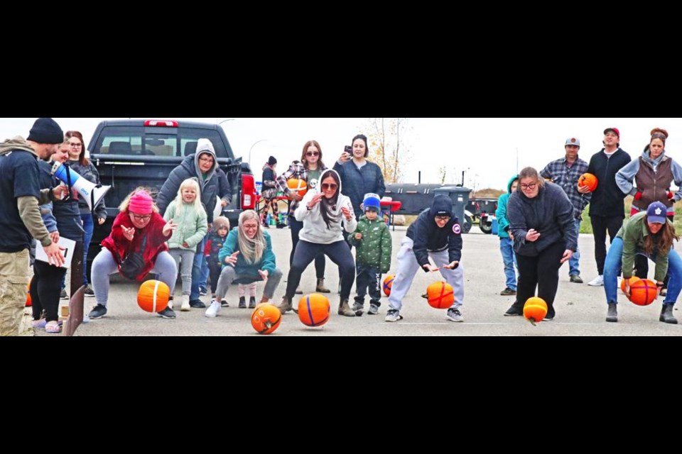 This was one of three qualifying heats for the adults age category in the Pumpkin Roll, and the top rollers went on to the final race.
