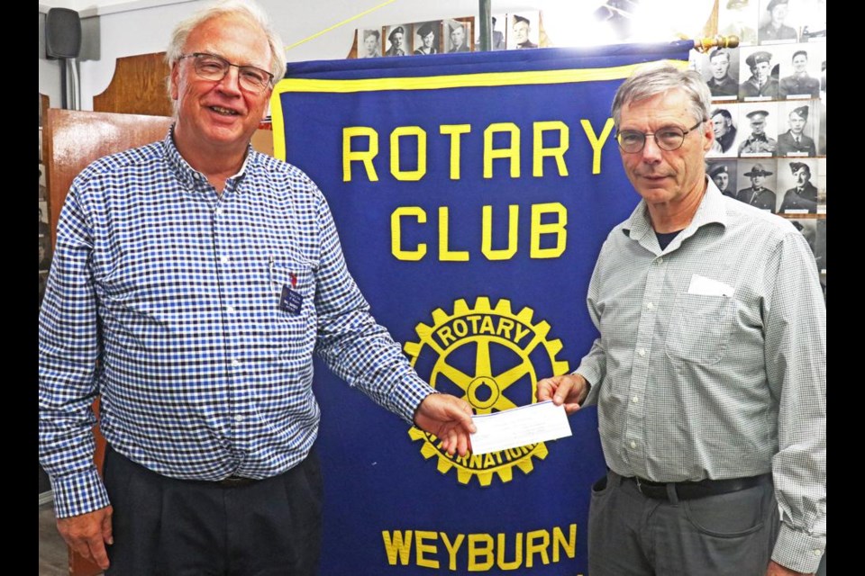 Mal Barber of the CMHA board in Weyburn accepted a donation of $1,500 from Weyburn Rotary Club president Doug Loden.