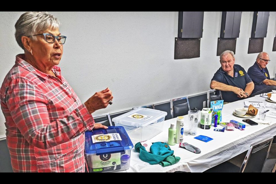 Weyburn Rotary member Gwen Wright explained what was involved in building the tote boxes, with many of the items on display on the table beside her, during their lunch meeting on Thursday.