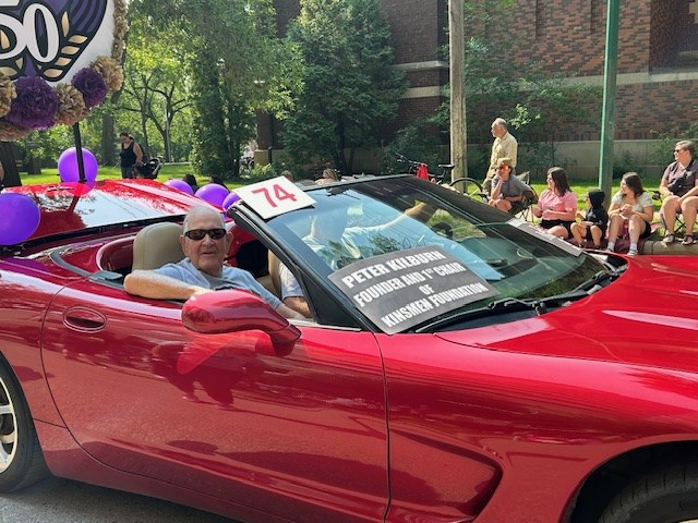 Credited with founding Telemiracle as well as serving as the first Kinsmen Foundation Chair, Peter Kilburn, helps promote Telemiracle 50 in the Saskatoon Ex parade.