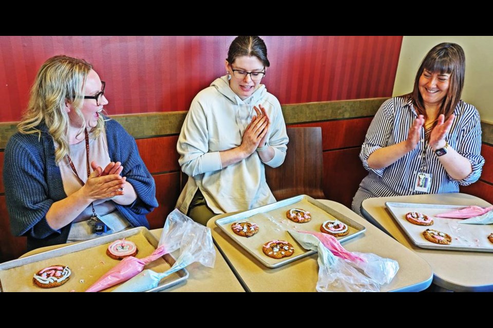 Three Sask. Health Authority employees were in the finalist round of a cookie decorating contest held on Monday morning at the Weyburn Tim Horton’s restaurant, to kick off this spring’s Smile Cookie campaign. From left are Lisa Kress, Amy Daniel and Lisa O’Dell, with Daniel’s cookie judged to be the best one. All of the proceeds of the campaign at the Weyburn store will go to the Weyburn and District Hospital Foundation.