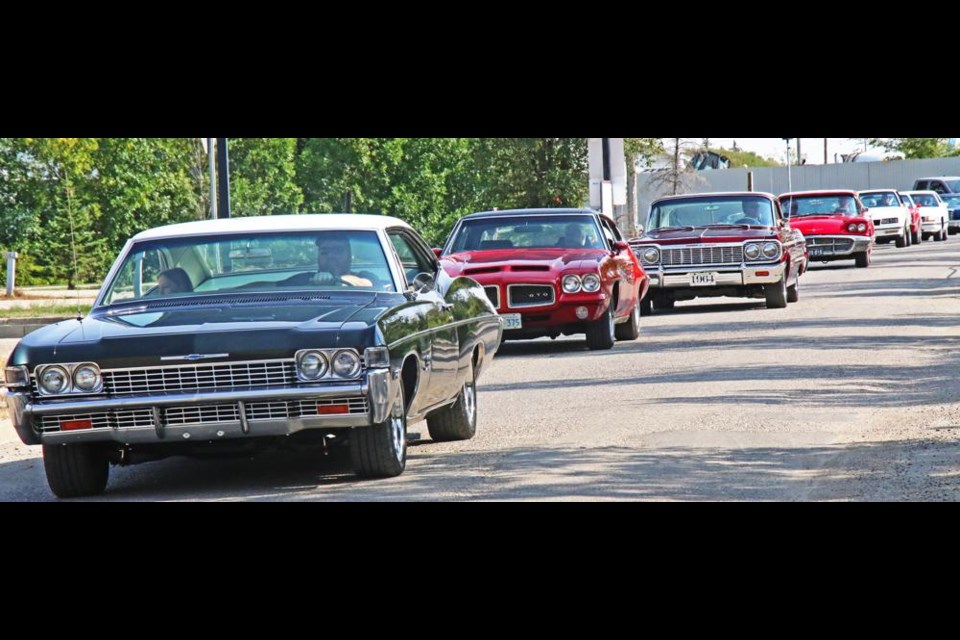 Members of Weyburn's Soo Line Cruisers car club made a tour of the city's long-term care homes on Sunday afternoon, here approaching the Tatagwa View care home.