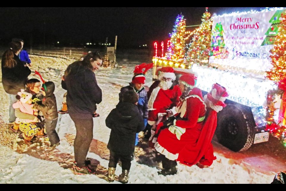 Moms and young children stopped by the Southeast College display to visit with Santa and Mrs. Claus on Monday evening.