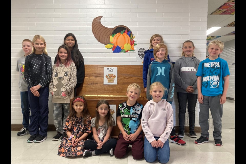 St. Peter’s School has run a food bank collection for the month of October for many years. The school also has an ongoing collection throughout the year and encourage students to donate whenever they want or can. Two students from Grades 1to 6 posed with their collections that will soon be delivered to Unity’s Food Bank. 