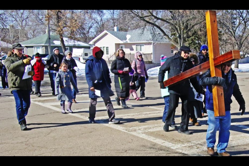 The Stations of the Cross were observed on Good Friday by parishioners from St. Vincent de Paul, as they stopped at key points around the city to pray.