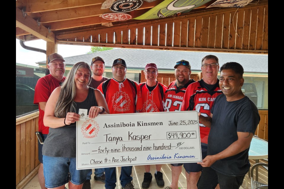 Assiniboia Kinsmen Chase the Ace netted the winner $49,900. Pictured here are Kinsmen members: Kim Dahlman, Chase the Ace winner, Tanya Kasper, Jerad Dahlman, Cooper Nicholson, Rock  Boisvenu, Brandon Welder, Howard Ellis, Manju Gangadharan  