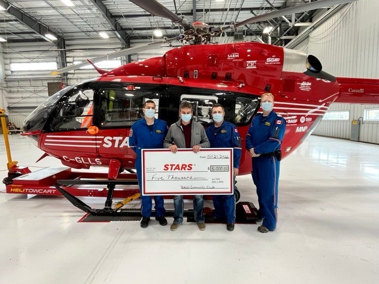 Todd Miller, representing the now folded Pascal Community Club, presented $5,000 to STARS  Air Ambulance.