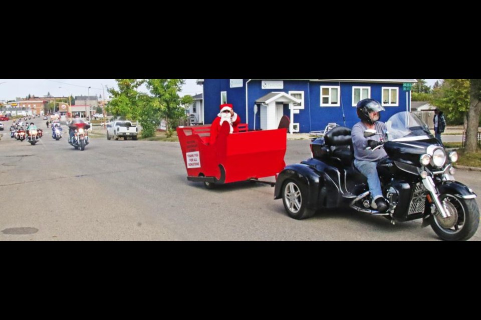 The Santa sleigh led the Weyburn Independent Riders' Toy Run up Third Street South on Saturday.