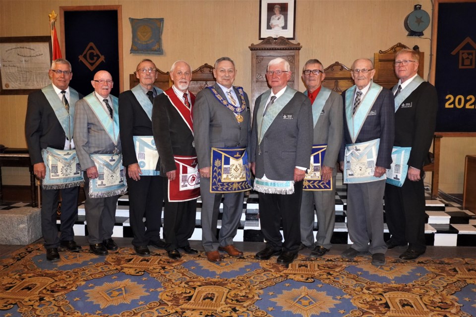Harvey Johnson, Vern Burns, Don Cumming, Byron Trapp, Bill Swiderski, Ed Houser, Bob Cumming, Si Campbell and Jerry Rewerts pose for one last picture before the Unity Kilwinning Masonic Lodge No. 73  moves into darkness.                       