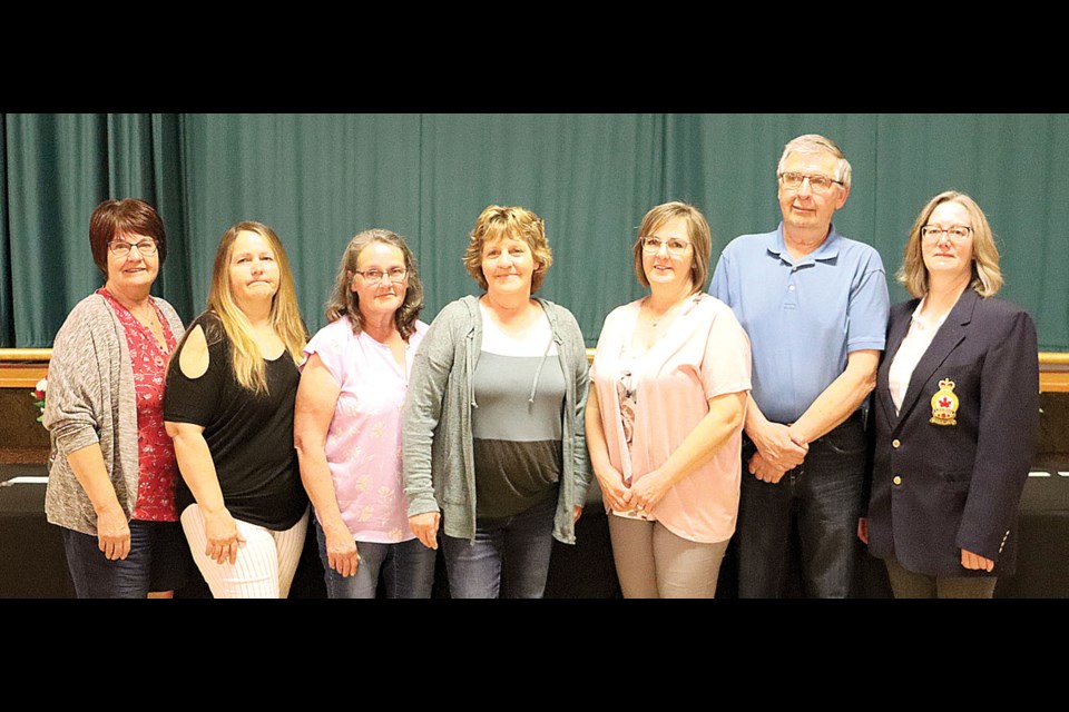 The family of Howard Schmidt was presented with a 60 year pin by comrade Conni Fowler (far right), which was awarded posthumously during the Weyburn Royal Canadian Legion awards night on May 16. From left are Dianne Brown, Joanne Babiarz, Dolores Roettger, Marlene Adderley, Val Lund and Don Schmidt. 