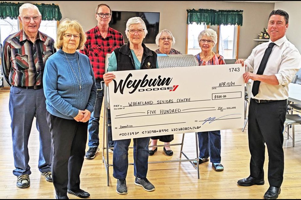 Board members of the Wheatland Seniors Centre accepted a donation of $500 from Jeff Toszcak of Weyburn Dodge, to be used as the first-place prize for the centre's raffle draws made on April 17. From left are Ernie Lokken, Jean Knibbs, Dave Rennie, president Theresa Istace, Marlene Szczecinski and Willa-Mae Donald, with Jeff at right.