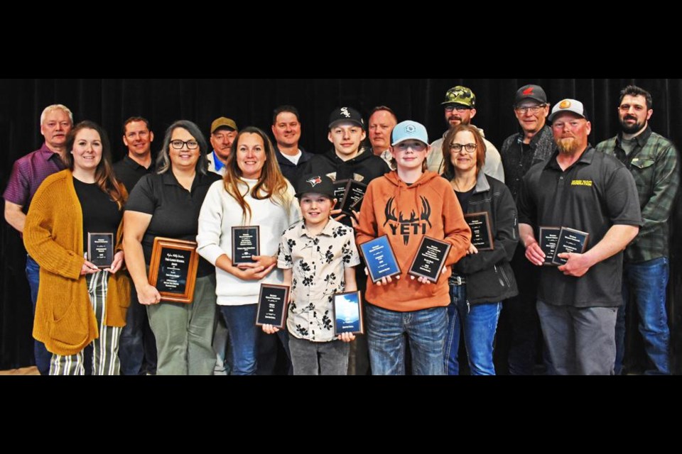 The award recipients at the Fred Garner Memorial Trophy and Banquet Night for the Weyburn Wildlife Federation gathered onstage at McKenna Hall on Saturday evening. In the  back row from left are Brian Maas, Troy Kincaid, Bruce Rosiak, Jeff Chinski, Russ Scharnatta, Ryder Watson, Lee Watson and Logan Miller. In the middle row are Haley Anderson, Terra Hartley Ortman, Becky Benson, Joel Benson, Cindy Paslawski and Colton Tochor. In front are Sawyer Knoll and Bosttin Mutrie. Missing was Judy Olfert and Layne Watson. 