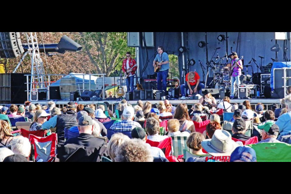 Opening act Brayden King played to a large audience near the beginning of the centennial celebration on Thursday.