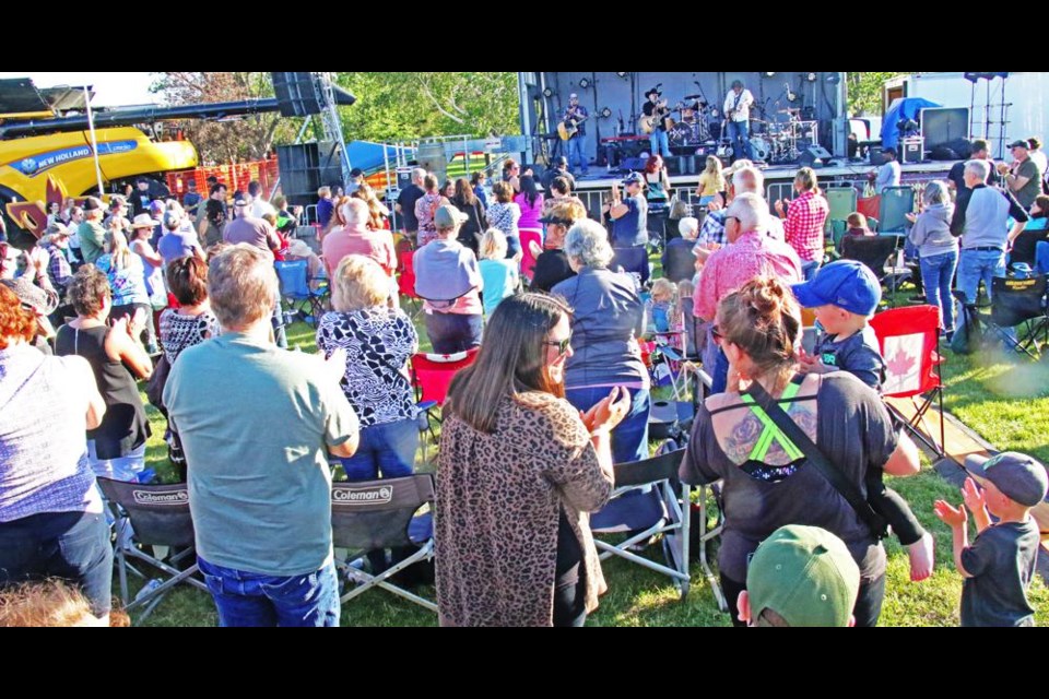 Opening act Dan Cugnet had the crowd stand to applaud the Young Fellows Club, during his set at the concert on Thursday.