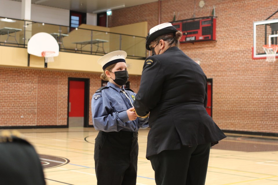 Commanding Officer, SLt Corey Anderson presents a cadet with an award.