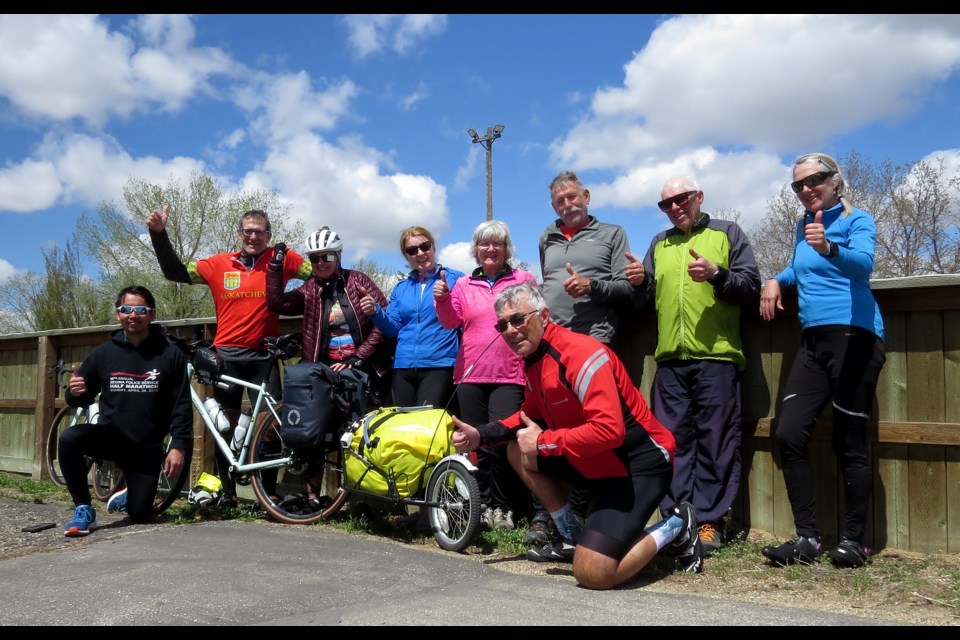 The cycling group gathers for a photo at the end of their ride.