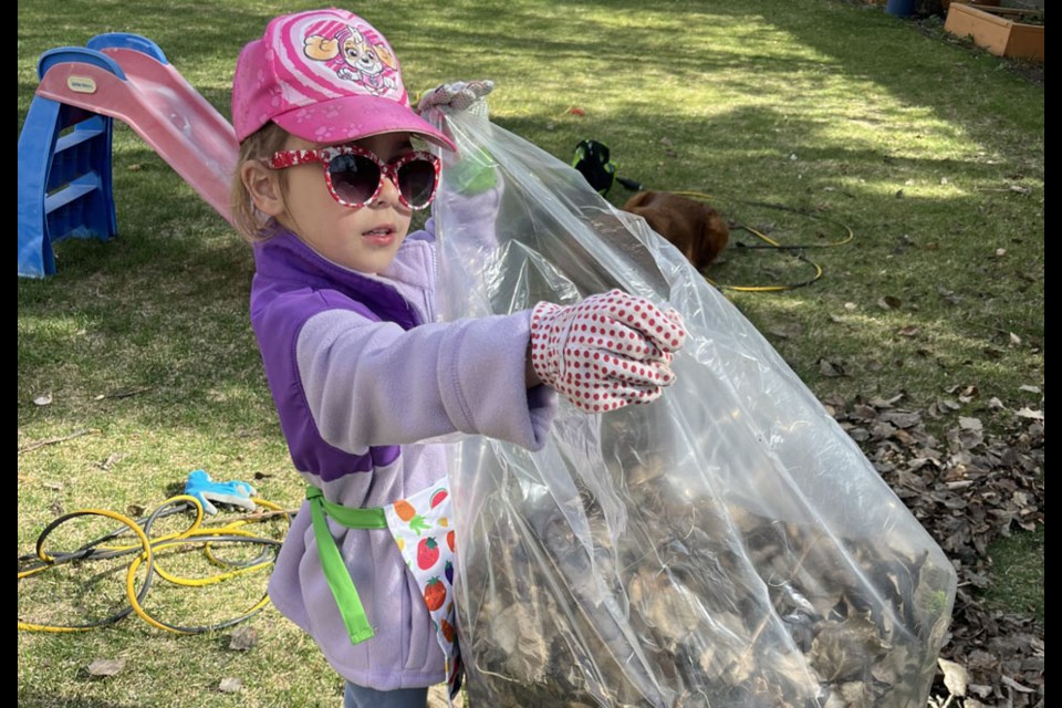 Becky helping with raking leaves.