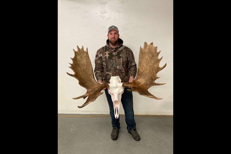 Pictured here, Ryan Decker, with the antlers of a moose he harvested in Zone 56.