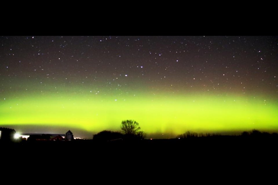 This is a wide shot of the northern skies with a bright green band of the Northern Lights, viewed near Weyburn on Friday night.