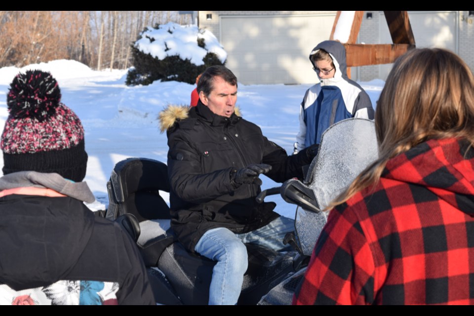 As part of the snowmobile safety course in Canora on Dec. 10, instructor Jerry Jemieff took the students outside and utilized a snowmobile to explain proper pre-start procedures, and then what needs to be done after the machine is running but before heading out for a ride.