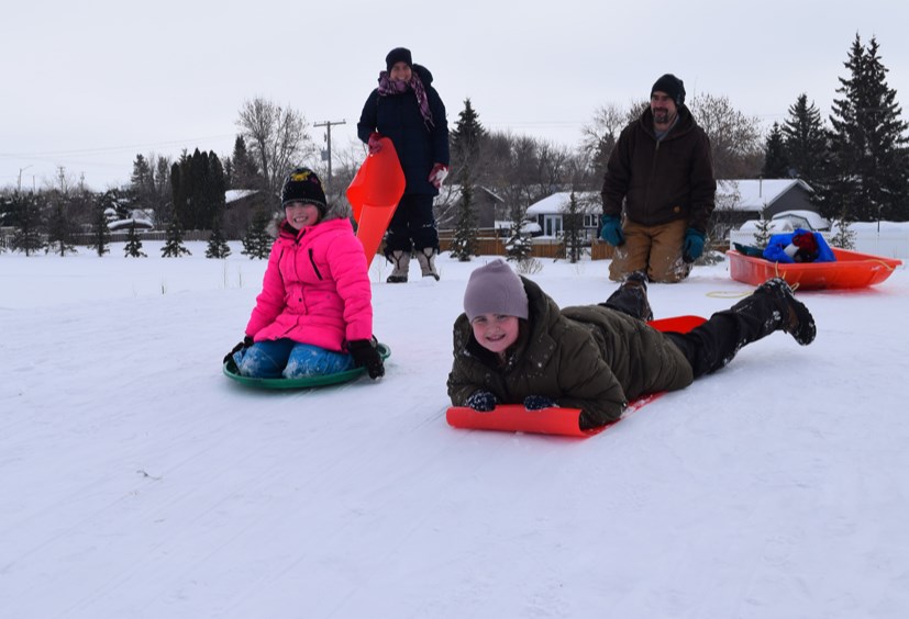 After a long stretch of severe cold, which seemed to last forever, the Tress family of Rhein took advantage of warmer temperatures on Feb. 5 to go flying down the Canora Community Hill.  Family members said they have thoroughly enjoyed this family outing to Canora for the past several years.