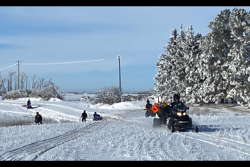 Leading the crew to get the trails signed was Trail Boss Rob Bletsky on the Trakkers club sled, followed by members placing signs to comply with the SSA regulations.