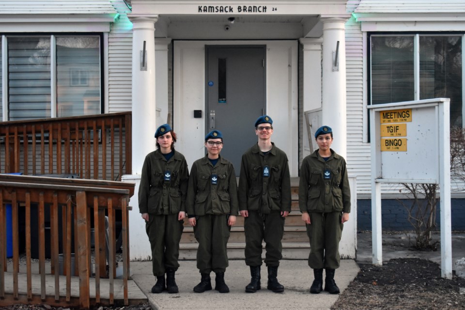 On April, 10 the senior Air Cadets came together for a photo in front of the Legion Hall and its blue lights from left they were, Flight Corporal Summer Erhardt, Flight Corporal Halo Tourangeau, Warrant Officer First Class Murdock Martinuik, and Flight Corporal Serenity Cote.