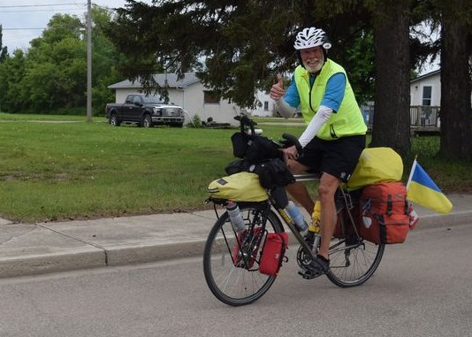 Peter Hilger of St. Paul, Minn. passed through Canora on July 4 during his cross-Canada bicycle trip, raising money for the education of dogs, orphans and college students. On his way from Saskatoon into Canora, he said he was moved by “seeing how strong the Ukrainian connection is in this region.”