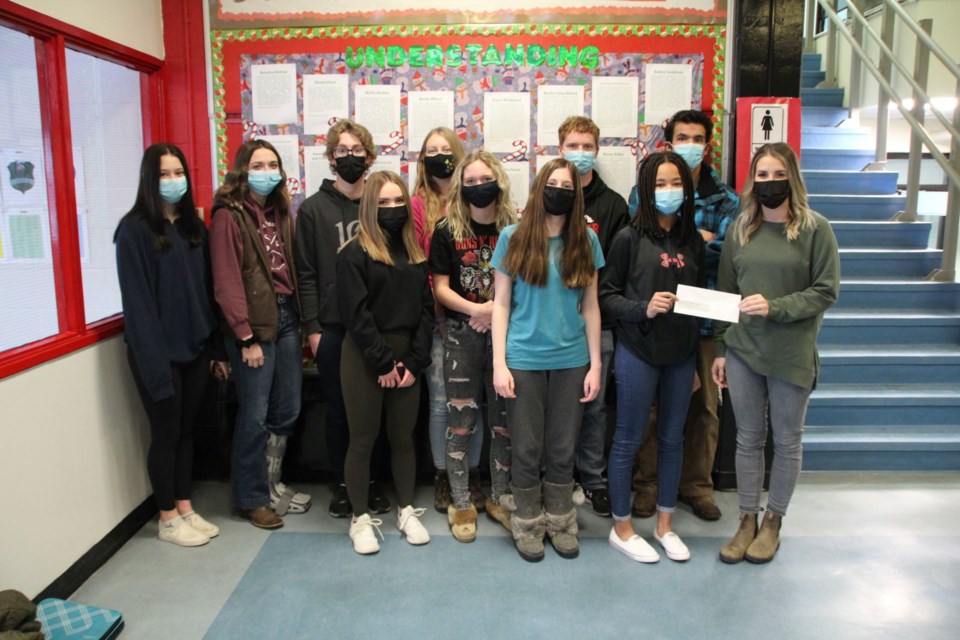 The UCHS Foods 30 class presents a cheque to UCHS EA, friend of the Silvernagel family.