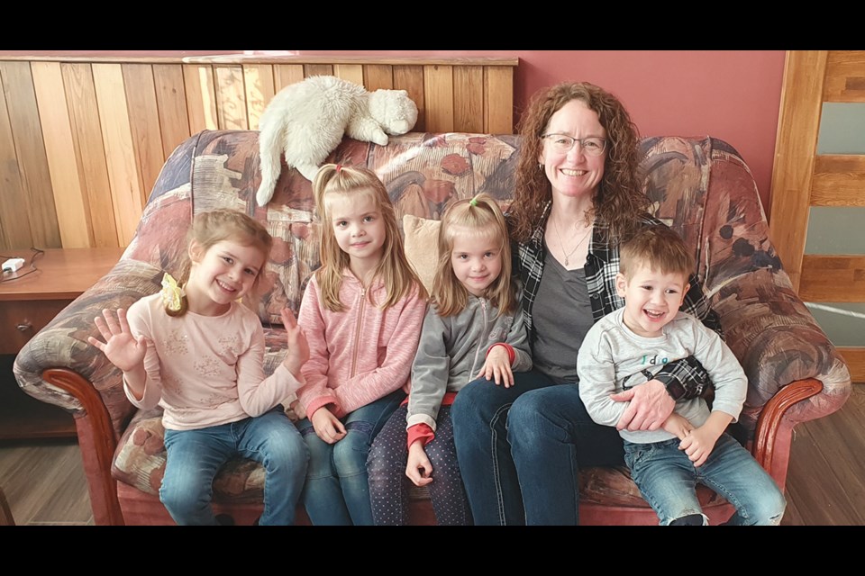 Cheryl with some of the children she works with. Trying to give them a sense of normalcy during such a turbulent time is important to Cheryl.

