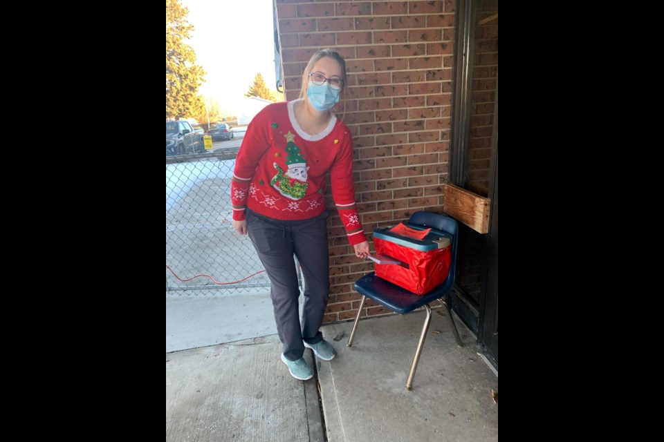 April Reiter dropped her Christmas cards in the drop box at Poplar Courts special care home, a community initiative to brighten the day of residents there.