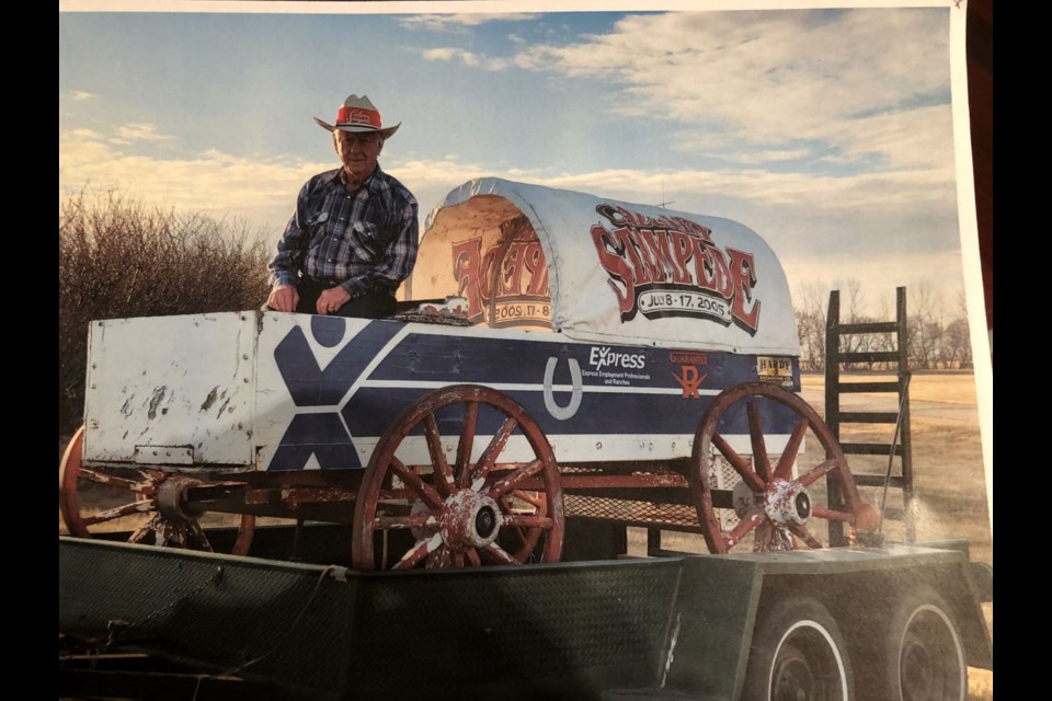 Roxanne Greenwald captured this photo of her dad, Bill Risling, sitting atop of the chuckwagon he now has displayed at his yard's entrance.